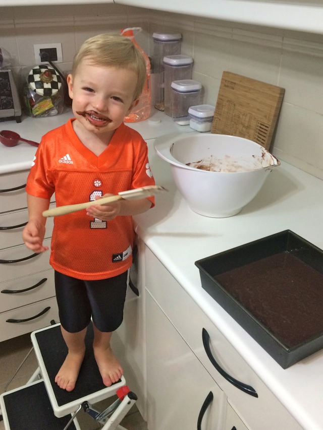 Baking brownies with Mom! Had to really convince him to try the batter but of course he loved it. 